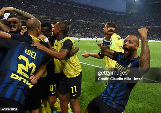 Ivan Perisic of FC Internazionale celebrates with team-mates and Felipe Melo after scoring the goal during the Serie A match between FC...