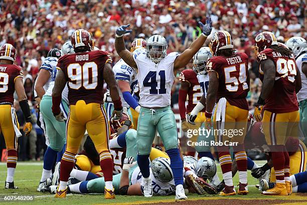 Fullback Keith Smith of the Dallas Cowboys celebrates after running back Ezekiel Elliott of the Dallas Cowboys scores a first quarter touchdown...