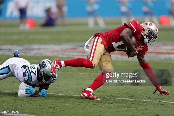 Jeremy Kerley of the San Francisco 49ers runs from Robert McClain of the Carolina Panthers in the 2nd quarter during their game at Bank of America...