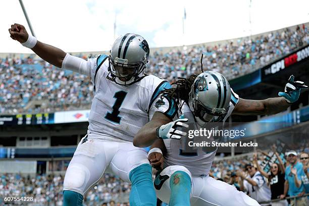 Cam Newton and teammate Kelvin Benjamin of the Carolina Panthers celebrate a touchdown against the San Francisco 49ers in the 3rd quarter during...