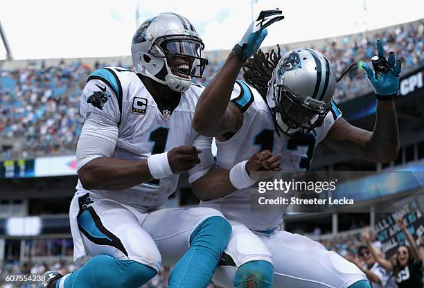Cam Newton and teammate Kelvin Benjamin of the Carolina Panthers celebrate a touchdown against the San Francisco 49ers in the 3rd quarter during...