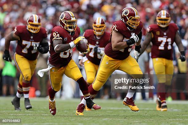 Tight end Niles Paul of the Washington Redskins carries the ball against the Dallas Cowboys in the third quarter at FedExField on September 18, 2016...