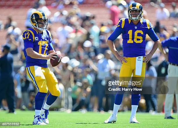 Quarterback Case Keenum and Jared Goff of the Los Angeles Rams warm up before their home opening NFL game against the Seattle Seahawks at Los Angeles...