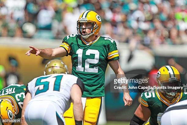 Quarterback Aaron Rodgers of the Green Bay Packers calls signals during a NFL game against the Jacksonville Jaguars at EverBank Field on September...