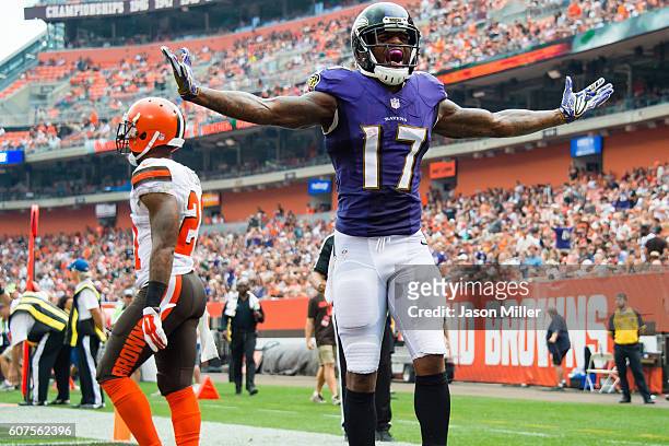 Wide receiver Mike Wallace of the Baltimore Ravens celebrates after catching a 17 yard touchdown pass from quarterback Joe Flacco during the third...