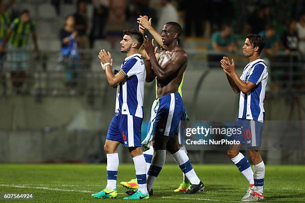 Porto's Portuguese midfielder Ruben Neves , Porto's French defender Willy Boly and Porto's Spanish midfielder Oliver Torres during Premier League...