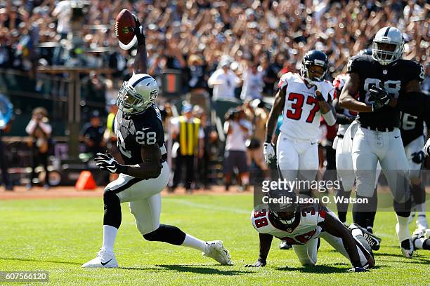 Latavius Murray of the Oakland Raiders celebrates after a 1-yard touchdown run during their NFL game against the Atlanta Falcons at Oakland-Alameda...