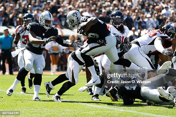 Latavius Murray of the Oakland Raiders scores a 1-yard touchdown during their NFL game against the Atlanta Falcons at Oakland-Alameda County Coliseum...
