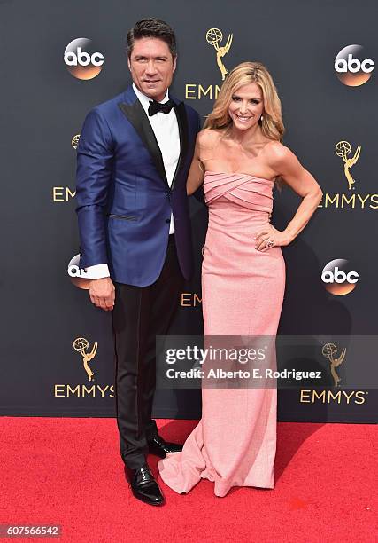 Personalities Louis Aguirre and Debbie Matenopoulos attend the 68th Annual Primetime Emmy Awards at Microsoft Theater on September 18, 2016 in Los...