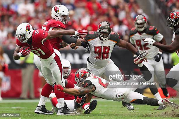 Running back David Johnson of the Arizona Cardinals rushes the football past strong safety Chris Conte of the Tampa Bay Buccaneers during the second...