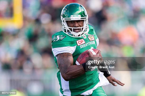 Darian Durant of the Saskatchewan Roughriders carries the ball in first half action of the game between the Edmonton Eskimos and Saskatchewan...