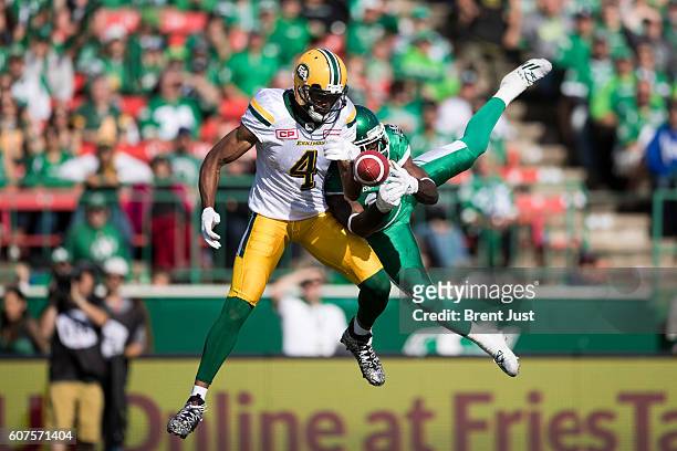 Ed Gainey of the Saskatchewan Roughriders breaks up a pass intended for Adarius Bowman of the Edmonton Eskimos in first half action of the game...