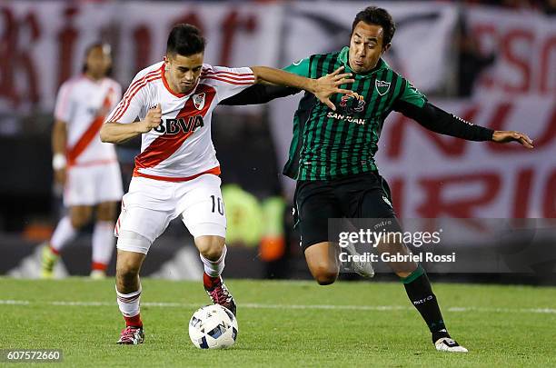 Gonzalo Martinez of River Plate fights for the ball with Marcos Gelabert of San Martin during a match between River Plate and San Martin as part of...