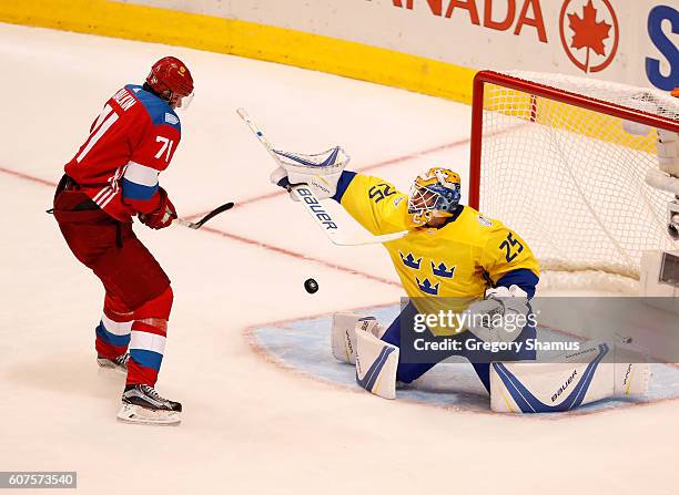 Evgeni Malkin of Team Russia tries to get off a shot against Jacob Markstrom of Team Sweden during the World Cup of Hockey at the Air Canada Center...