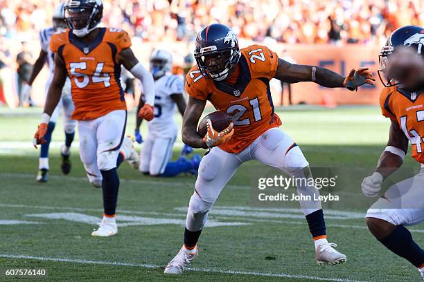 Aqib Talib of the Denver Broncos makes a pick-six on a ball thrown by Andrew Luck of the Indianapolis Colts intended for Phillip Dorsett during the...