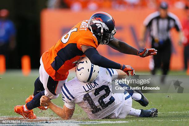 Free safety Darian Stewart of the Denver Broncos is called for unnecessary roughness for tackling quarterback Andrew Luck of the Indianapolis Colts...