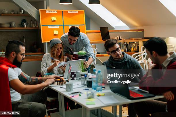 development team cooperating in their office. - programming team stock pictures, royalty-free photos & images