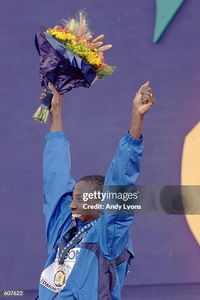 Fiona May of Italy celebrates after accepting the gold medal in the women's Long Jump final at the 8th IAAF World Athletic Championships in Edmonton,...