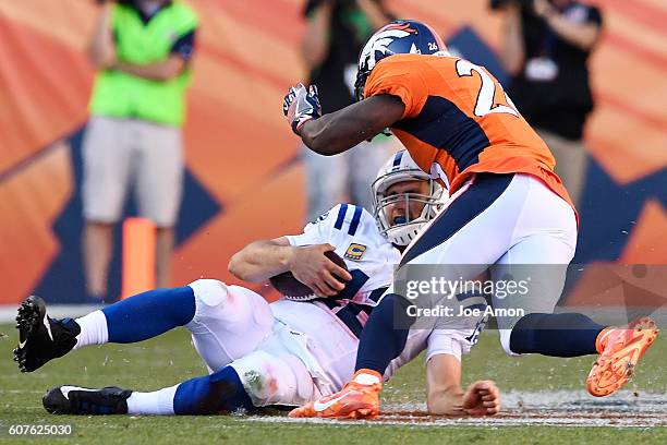 Darian Stewart of the Denver Broncos goes high on a tackle on Andrew Luck of the Indianapolis Colts during the fourth quarter of the Broncos' 34-20...