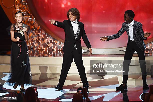 Actors Millie Bobby Brown, Gaten Matarazzo and Caleb McLaughlin perform onstage during the 68th Annual Primetime Emmy Awards at Microsoft Theater on...