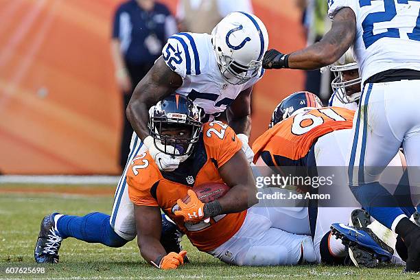 Qwell Jackson of the Indianapolis Colts tackles C.J. Anderson of the Denver Broncos during the fourth quarter of the Broncos' 34-20 win. The Denver...