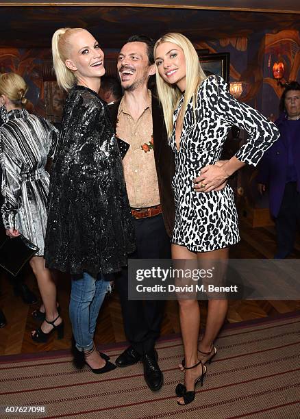 Poppy Delevingne, Matthew Williamson and Jessica Hart attend the launch of "Vogue: Voice Of A Century", a new book celebrating Vogue Britain's...