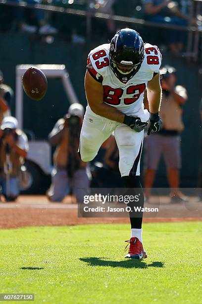 Jacob Tamme of the Atlanta Falcons celebrates after a 14-yard catch for a touchdown against the Oakland Raiders during their NFL game at...