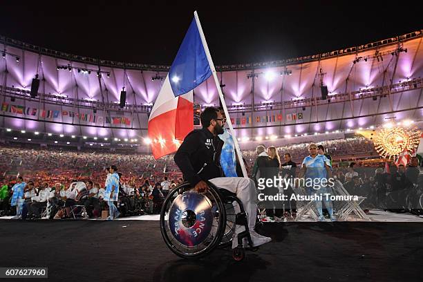 Wheelchair Tennis athlete Michael Jeremiasz carries the flag for France during the closing ceremony of the Rio 2016 Paralympic Games at Maracana...