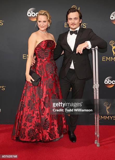 Actor Rupert Friend and Aimee Mullins attend the 68th Annual Primetime Emmy Awards at Microsoft Theater on September 18, 2016 in Los Angeles,...