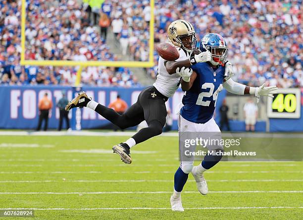 Brandin Cooks of the New Orleans Saints attempts to make a catch against Eli Apple of the New York Giants during the second half at MetLife Stadium...