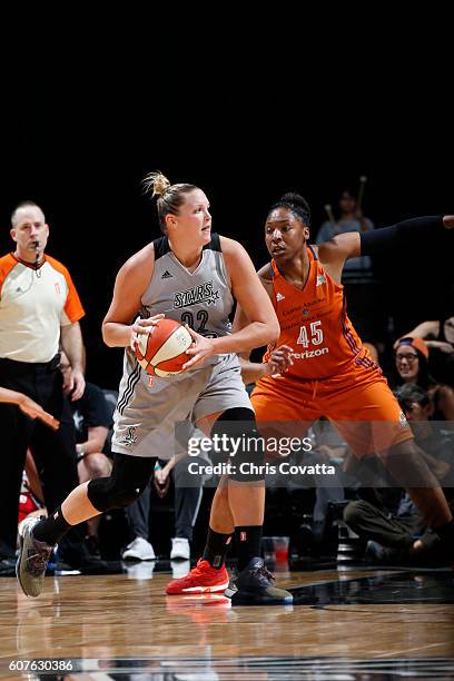 Jayne Appel-Marinelli of the San Antonio Stars handles the ball against Kelsey Bone of the Phoenix Mercury on September 18, 2016 at AT&T Center in...