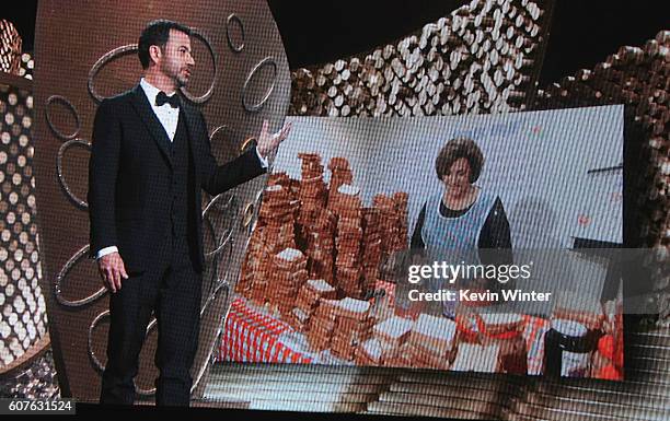 Seen on video screen, host Jimmy Kimmel speaks to mother Joann Iacono as she makes peanut butter and jelly sandwiches for the audience during the...