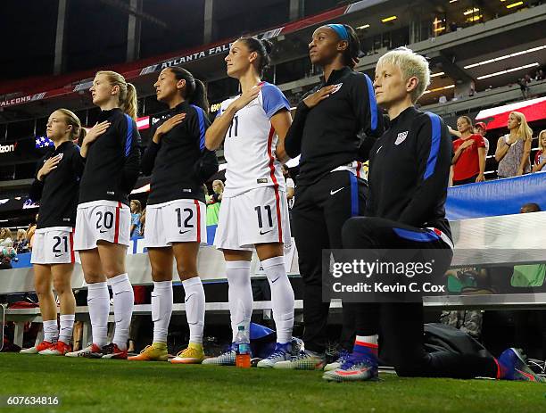 Megan Rapinoe kneels during the National Anthem prior to the match between the United States and the Netherlands at Georgia Dome on September 18,...