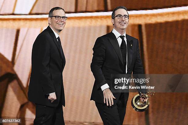 Writer/producer Tim Carvell and TV personality John Oliver accept Outstanding Variety Talk Series for 'Last Week Tonight with John Oliver' onstage...