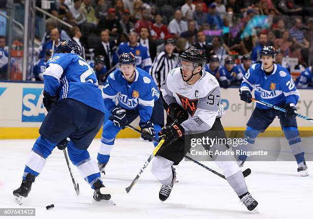 Connor McDavid of Team North America stickhandles the puck past Ville Pokka of Team Finland during the World Cup of Hockey 2016 at Air Canada Centre...