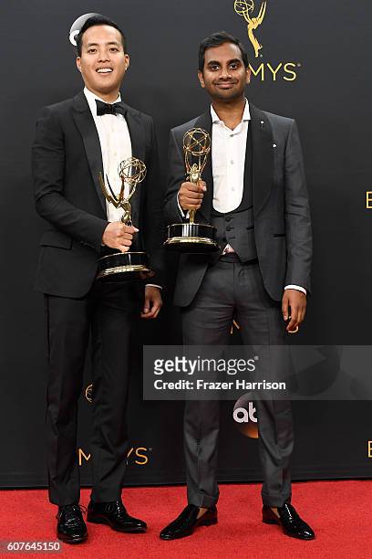 Writer-producer Alan Yang and actor-comedian Aziz Ansari, winners of Best Writing for a Comedy Series for "Master of None", pose in the press room...