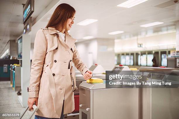 lady entering train platform with smartwatch - joint commission stock pictures, royalty-free photos & images
