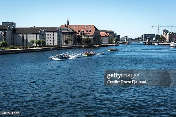 three canal tour boats in copenhagen harbour - dorte fjalland fotografías e imágenes de stock