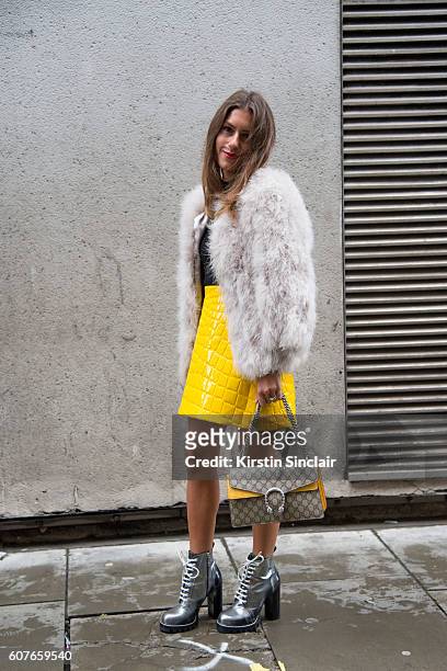 Fashion Blogger Annacarla e Simona is wearing top and jacket by Topshop, skirt by Miu Miu, bag by Gucci and shoes by Louis Vuitton day 1 of London...