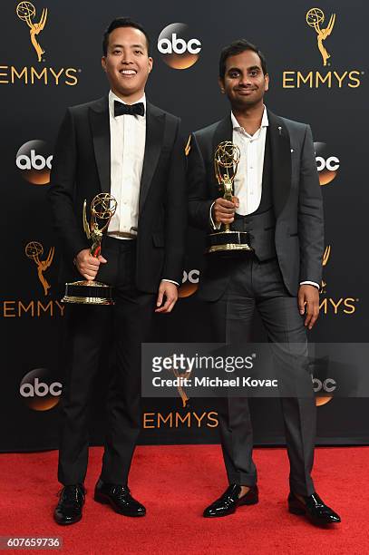 Writer-producer Alan Yang and actor-comedian Aziz Ansari, winners of Best Writing for a Comedy Series for 'Master of None', pose in the press room at...