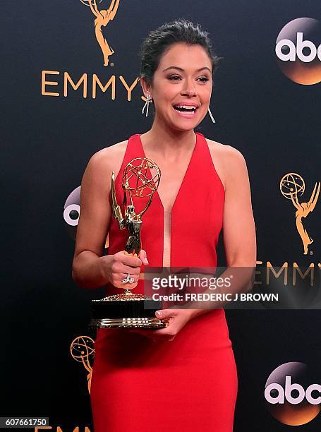 Tatiana Maslany, winner of Outstanding Actress in a Drama Series for "Orphan Black", poses in the press room during the 68th Emmy Awards on September...
