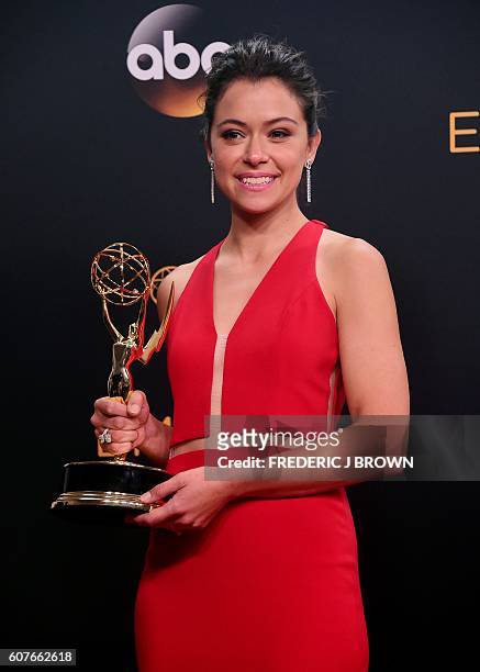 Tatiana Maslany, winner of Outstanding Actress in a Drama Series for "Orphan Black", poses in the press room during the 68th Emmy Awards on September...