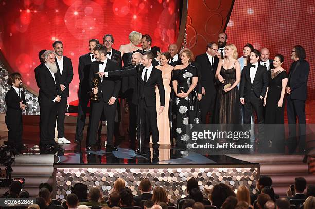 Writer/producers David Benioff and D.B. Weiss with production crew accept the award for Outstanding Drama Series for 'Game of Thrones' onstage during...