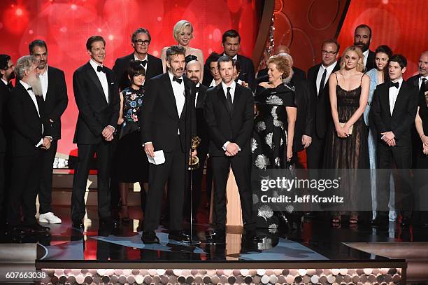 Writer/producers David Benioff and D.B. Weiss with production crew accept the award for Outstanding Drama Series for 'Game of Thrones' onstage during...