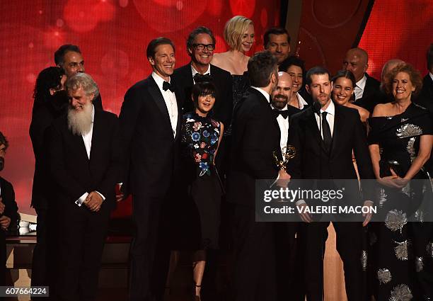 Writer/producers David Benioff , and D.B. Weiss with cast and crew accept the award for Outstanding Drama Series for 'Game of Thrones' during the...
