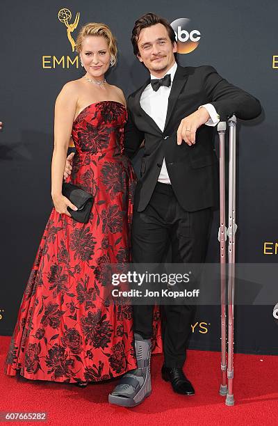 Actor Rupert Friend and wife Aimee Mullins arrive at the 68th Annual Primetime Emmy Awards at Microsoft Theater on September 18, 2016 in Los Angeles,...