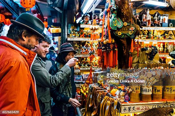 three friends shopping in asian market - taipei market stock pictures, royalty-free photos & images