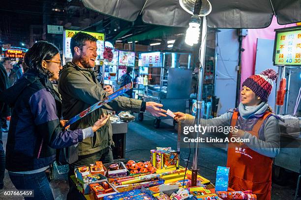 mixed race couple shopping in outdoor asian market - taiwan market stock pictures, royalty-free photos & images