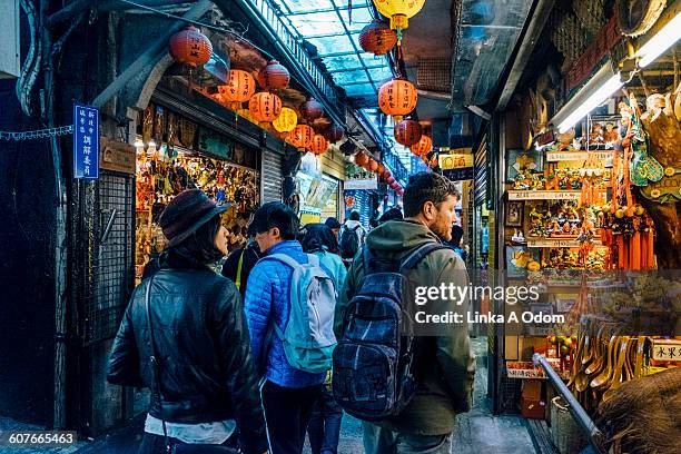 mixed race couple shopping in outdoor asian market - taipei stock pictures, royalty-free photos & images