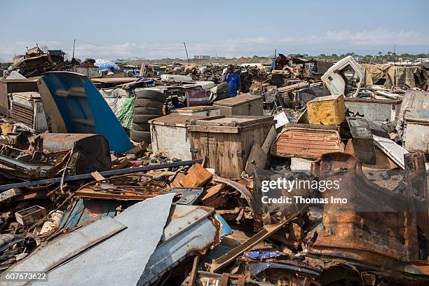 Accra, Ghana Biggest electronic scrap yard of Africa in Agbogbloshie, a district of the Ghanaian capital Accra. In the background an African worker...